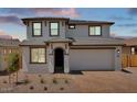 Charming two-story home boasts a neutral exterior with a two-car garage and well-manicured landscaping at 10912 E Tiburon Ave, Mesa, AZ 85212