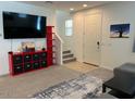 Cozy living room featuring a large TV and modern storage solutions at 1718 S 82Nd Way, Mesa, AZ 85209