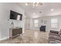 Bright living area featuring neutral decor, tile flooring, and an open layout at 18555 N 114Th Ave, Surprise, AZ 85378