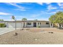 Inviting single-story home showcasing desert landscaping and a well-manicured front yard at 2424 E Fairfield St, Mesa, AZ 85213