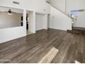 Open concept living room with hardwood floors and natural light at 25038 N 40Th Ave, Phoenix, AZ 85083