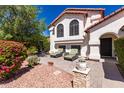 Inviting backyard featuring a stone patio with outdoor seating at 2630 E Dolphin Ave, Mesa, AZ 85204