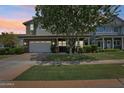 Charming home with a well-manicured lawn, two-car garage, and attractive landscaping at 2942 E Appaloosa Rd, Gilbert, AZ 85296