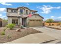 Charming two-story home featuring a tile roof, desert landscaping, and a two car garage at 3033 W Redwood Ln, Phoenix, AZ 85045