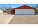 Exterior showcasing the side of the home with gravel landscaping at 5371 S Country Club Way, Tempe, AZ 85283