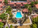 Aerial view of a community pool and spa surrounded by lush landscaping and well-maintained grounds at 7911 E San Miguel Ave # 3, Scottsdale, AZ 85250