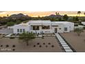 Stylish home with modern design, clean lines, desert landscaping, and a concrete paver walkway at 8520 E Cactus Wren Rd, Scottsdale, AZ 85250