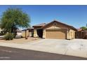 Charming single-Gathering home featuring a well-manicured front yard and a two-car garage at 10628 W Country Club Trl, Peoria, AZ 85383