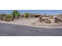 Well-kept front yard with desert landscaping, offering a welcoming approach to the house at 10655 E Broadway Rd, Mesa, AZ 85208