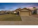 Charming single-story home features a well-manicured lawn and two car garage at 1350 E Vaughn Ave, Gilbert, AZ 85234