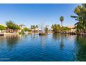 Scenic waterfront view featuring a central fountain and palm trees at 1350 E Vaughn Ave, Gilbert, AZ 85234