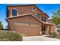 Charming two-story home featuring a two-car garage and low-maintenance desert landscaping at 18475 N Madison Rd, Maricopa, AZ 85139