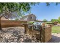 Backyard with built in stainless steel BBQ grill and preparation space at 2257 E Redwood Ct, Chandler, AZ 85286