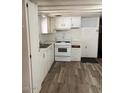 Compact kitchen with white appliances and cabinets at 2650 W Union Hills Dr # 331, Phoenix, AZ 85027