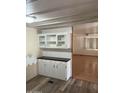 View of kitchenette with adjacent living room area at 2650 W Union Hills Dr # 331, Phoenix, AZ 85027