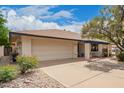Attractive single-story home boasts a large garage and a covered patio area, great curb appeal at 2745 S Emerson Cir, Mesa, AZ 85210