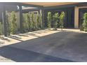 Carport featuring a shaded parking area with modern design and manicured landscaping at 3033 N 39Th St # 5, Phoenix, AZ 85018