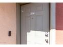 A secure front door with the unit number 2816, a modern doorbell, and a keypad entry at 3600 N Hayden Rd # 2816, Scottsdale, AZ 85251