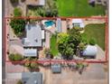 Aerial view of the property highlighting the backyard pool, patio, and surrounding landscape at 4112 W Monte Cristo Ave, Phoenix, AZ 85053