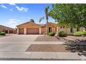 Charming home with a well-kept lawn and a three car garage at 4204 S Winter Ln, Gilbert, AZ 85297
