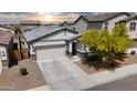 Aerial view of a well-maintained single-story home with a two-car garage in a residential neighborhood at 5726 W Atlantis Way, Phoenix, AZ 85043