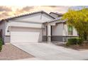 Attractive one-story home featuring a two-car garage and well-kept front yard landscaping at 5726 W Atlantis Way, Phoenix, AZ 85043
