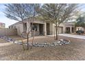 Charming single-story home with desert landscaping, a covered porch, and a two-car garage at 9303 W Oregon Ave, Glendale, AZ 85305