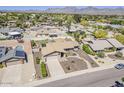 An aerial view of the property highlights the mature landscaping and proximity to mountain views at 9466 E Laurel Ln, Scottsdale, AZ 85260