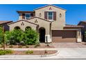 Charming two-story home with a desert landscape, two-car garage and tasteful architectural details at 9548 E Rainbow Ave, Mesa, AZ 85212
