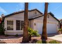 Inviting single-story home featuring a two-car garage and desert landscaping at 1279 N Blackstone Dr, Chandler, AZ 85224