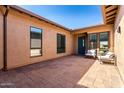 Cozy courtyard featuring tiled flooring, comfortable seating, and views through multiple windows at 1330 E Monte Way, Phoenix, AZ 85042