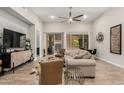 Bright living room features neutral colors, modern decor, and large windows for natural light at 15550 S 5Th Ave # 130, Phoenix, AZ 85045