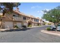 Charming townhome featuring a private garage, well-maintained landscaping, and a welcoming curb appeal at 1633 E Lakeside Dr # 98, Gilbert, AZ 85234
