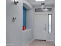 Light and bright entryway boasts neutral walls, tiled floors, a windowed door, and a built-in niche at 1650 S Crismon Rd # 86, Mesa, AZ 85209