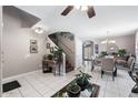 Open-concept living area with tile floors, stairs to the second level and natural light, ideal for Gathering gatherings at 1870 E Oakland St, Gilbert, AZ 85295