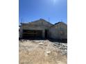 New construction home in progress showcasing the bare frame and stucco exterior with scaffolding at 1997 E Bucking Bronco Dr, San Tan Valley, AZ 85140