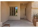 Inviting front porch with a decorative pot and a window with shutters at 22322 N 77Th St, Scottsdale, AZ 85255