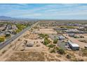 Scenic aerial view of homes and land with desert vegetation, offering a glimpse of the tranquil community surroundings at 22819 E Ray Rd, Mesa, AZ 85212