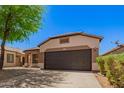 Charming single-story home featuring a well-maintained yard, desert landscaping and a spacious two-car garage at 28072 N Quartz Dr, San Tan Valley, AZ 85143