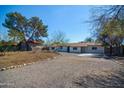 Attractive single-level home boasts a spacious driveway and low-water landscaping, combining convenience and charm at 3249 E Sunnyside Ln, Phoenix, AZ 85032