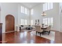 Bright living room with high ceilings, hardwood floors, and ample natural light at 3574 E Glacier Pl, Chandler, AZ 85249