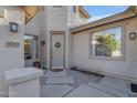 Charming front entrance with a decorative wreath, modern lighting, and stone accents at 4093 E Dublin St, Gilbert, AZ 85295