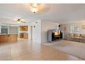 Open concept living and dining area with tile flooring and lots of natural light at 4333 E Desert Cactus St, Phoenix, AZ 85032