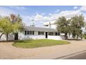 Lovely single-story home with a well-maintained lawn and updated exterior features, offering inviting curb appeal at 6522 E 2Nd St, Scottsdale, AZ 85251