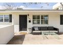 Welcoming front porch with stylish outdoor furniture, creating a cozy and inviting entrance at 6522 E 2Nd St, Scottsdale, AZ 85251