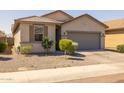 Inviting home with a well-kept yard and desert landscaping for easy maintenance at 7343 W Hughes Dr, Phoenix, AZ 85043