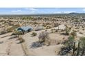 Bird's eye view shows the home's placement within the desert landscape, including horse enclosure at 870 S La Paz Rd, Maricopa, AZ 85139