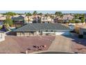Inviting single-story home with desert landscaping, gray roof and a two-car garage in residential neighborhood at 1057 S 74Th St, Mesa, AZ 85208