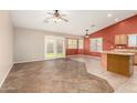 Open concept featuring tile floor, breakfast bar, ceiling fans, with backyard access at 1138 E Avenida Isabela St, Casa Grande, AZ 85122