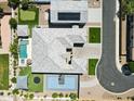 Aerial view of home showing pool, basketball court, putting green and lush landscaping at 1160 E Cedar Pl, Chandler, AZ 85249